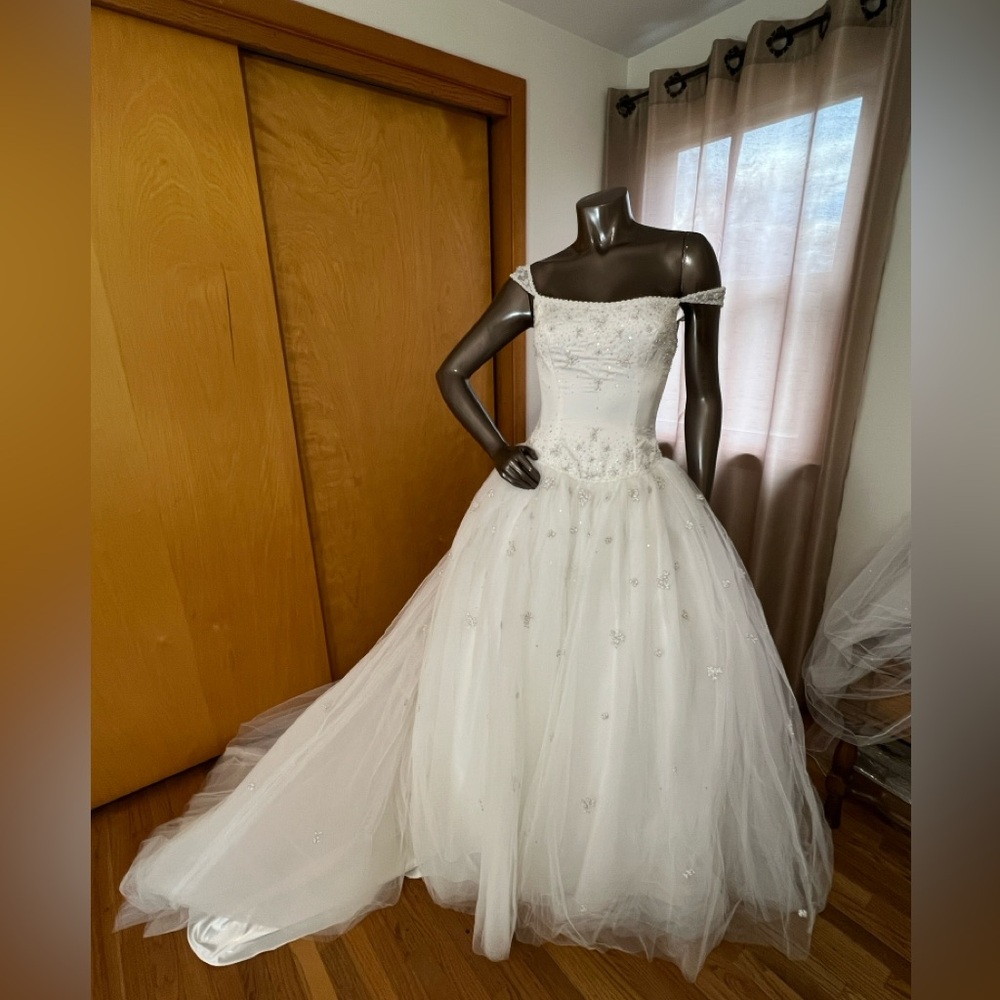 White Mori Lee ballgown with beading and cathedral length train.